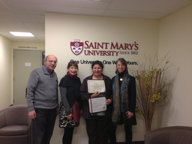 Helen Andrew, Innu Researcher, receiving certificates for Saint Mary’s University [photo courtesy of Libby Dean]